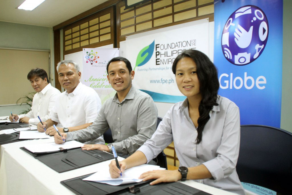 FPE and Globe seal their latest collaboration for the benefit of the communities involved in the Up-scaling Forest Restoration Efforts in Key Biodiversity Areas project. From left to right: Mr. Godofredo T. Villapando, Jr., Executive Director of FPE; Mr. Nestor R. Carbonera, Chair and CEO of the FPE Board of Trustees; Mr. Fernando C. Esguerra, Jr., Head, Corporate Social Responsibility - Globe Telecom, Inc.; and Ms. Carmela David, Sr. Specialist, Corporate Social Responsibility - Globe Telecom, Inc.
