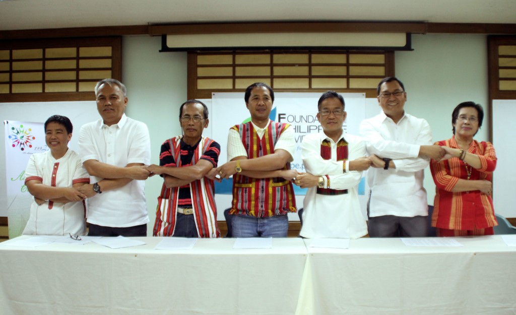 The signatories of the Memorandum of Understanding (MOU) among the Maeng IP groups of Tubo, Abra and the DepEd and NCIP bureaus of the said area extend a gesture of collaboration after the official signing of the document. Mr. Nestor Carbonera, Chair and CEO of FPE (second from left), represented the Foundation's full support as a signing witness.